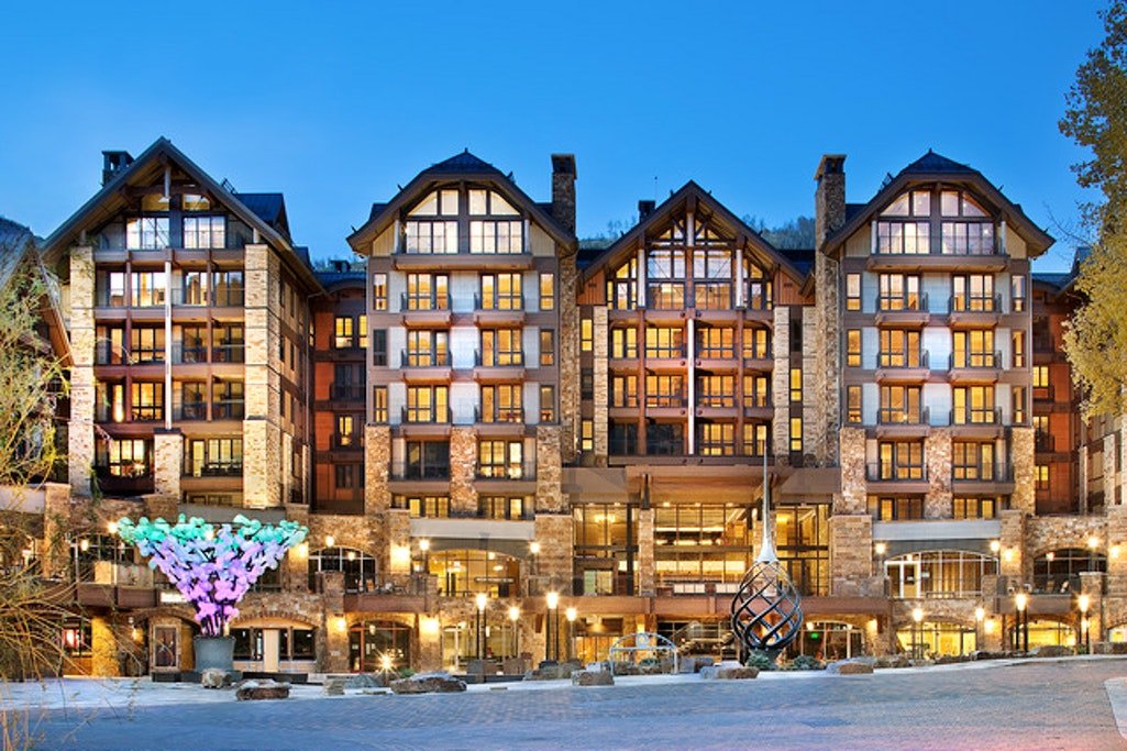 Well lit in the early evening the Solaris Vail vacation rental shown from the street view.
