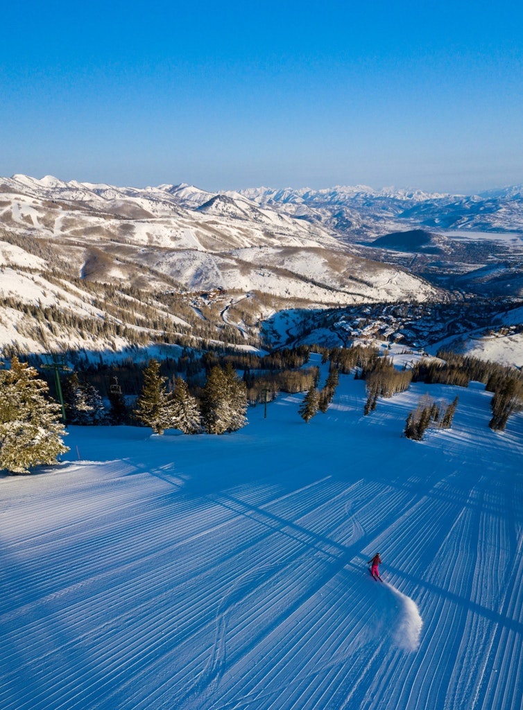 Drone view of skier and mountains Drone view of skier and mountains