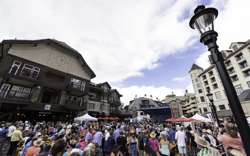 2018 Blues Brews and BBQ Festival in Beaver Creek, CO. A crowd enjoying a summer music festival in Beaver Creek Village
