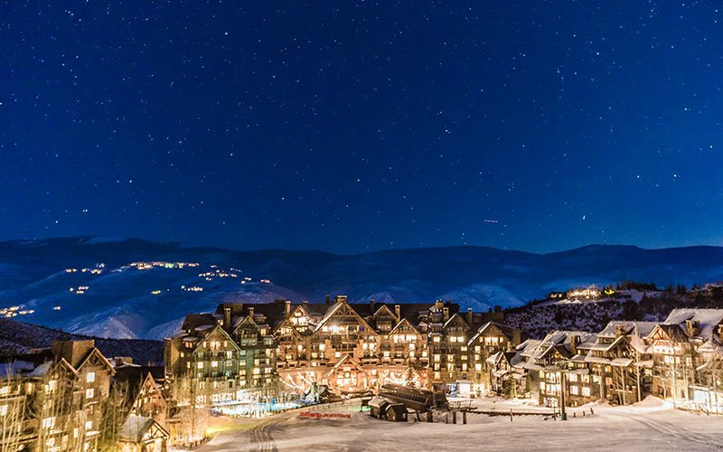 Luxury winter view of the Ritz-Carlton in Bachelor Gulch, lit up under a starry night sky in Beaver Creek, Colorado. Luxury winter view of the Ritz-Carlton in Bachelor Gulch, lit up under a starry night sky in Beaver Creek, Colorado.