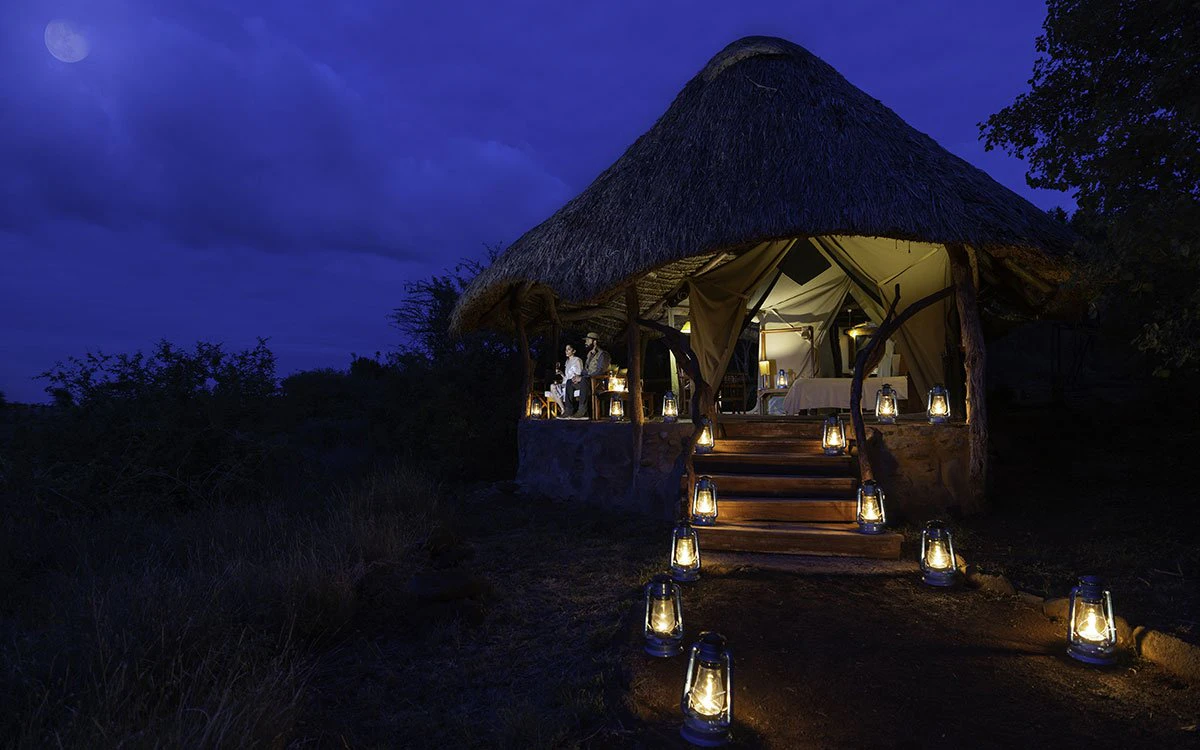 An alighted pathway leading to moon viewings at Lewa at night