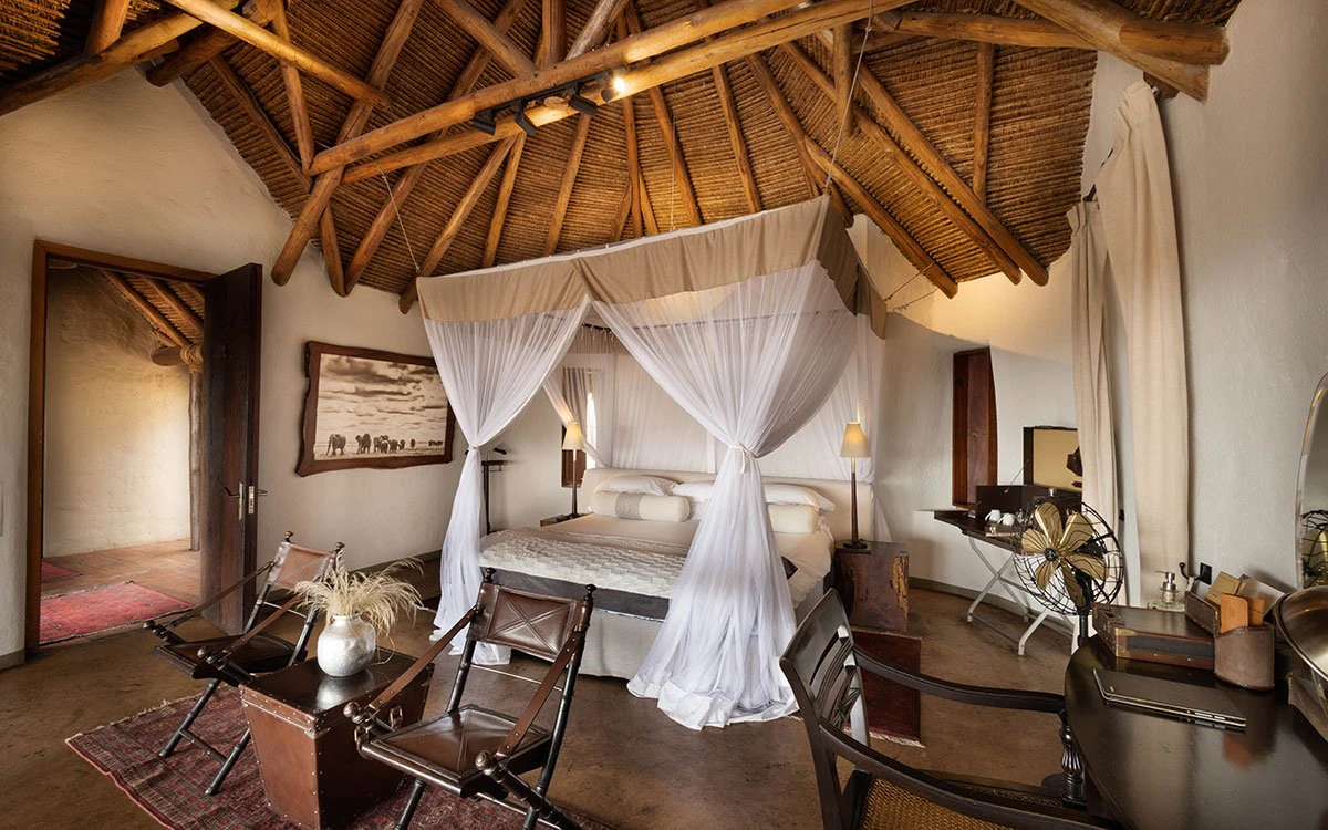 Interior view of a luxury bedroom at ol Donyo Lodge