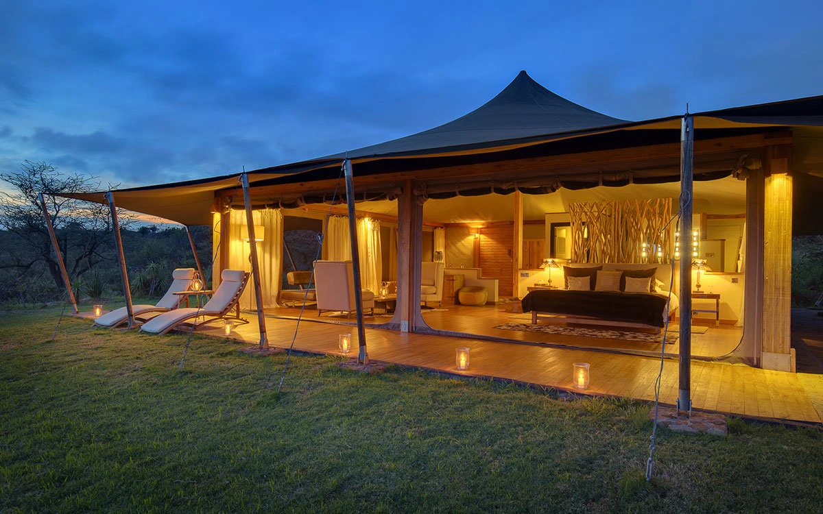 Exterior view of the family tent at Loisaba Tented Camp just after sunset beautifully lit up