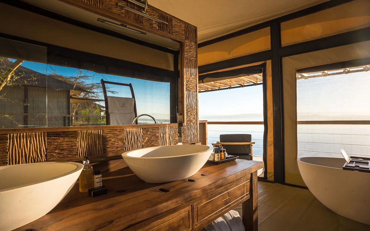 Internal image of the en suite bathroom at The Cliff with the tub and two sinks in view