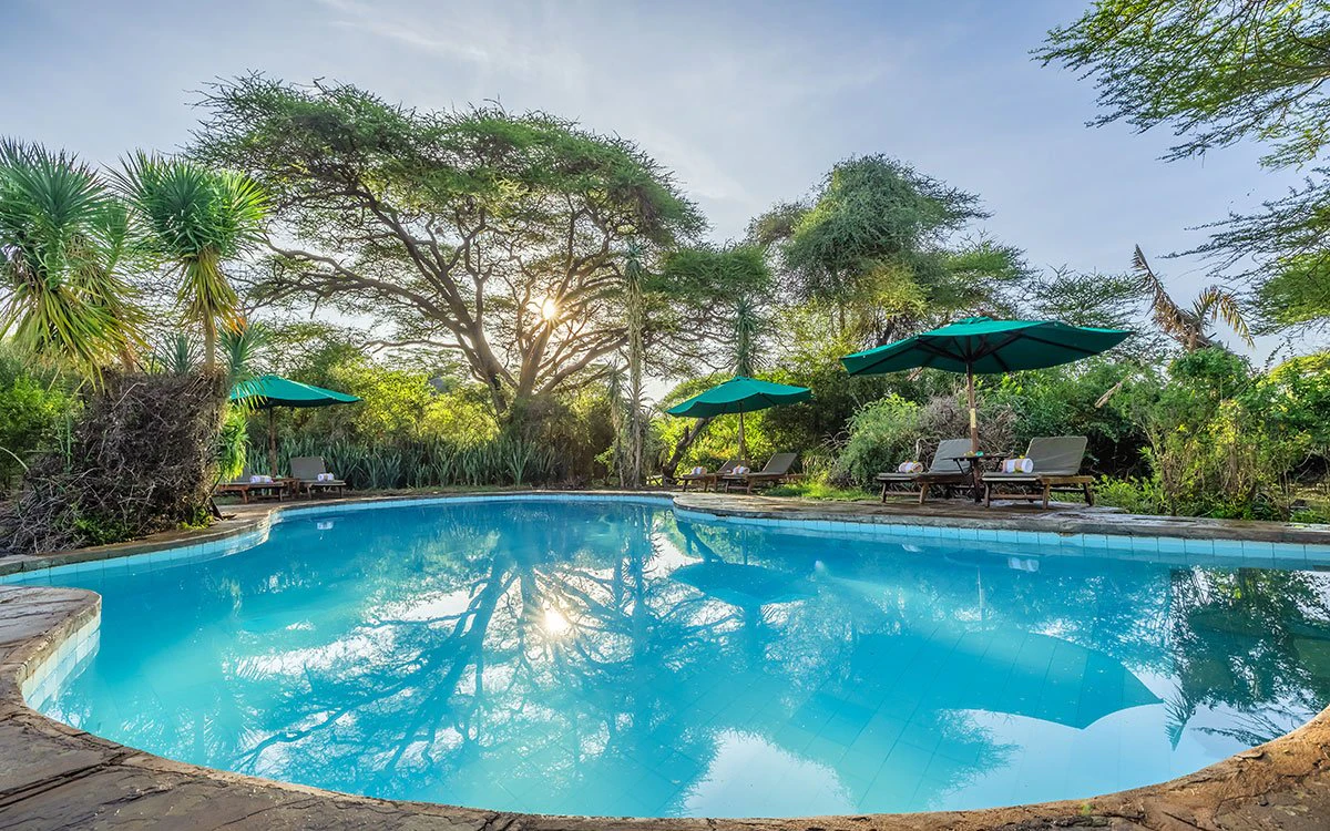 Wide angle view of the main pool, complete with sun loungers and umbrellas
