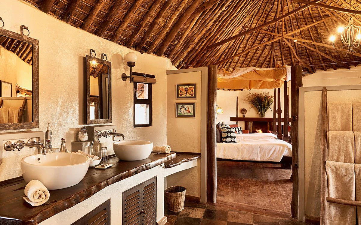 Interior view of the en suite bathroom at Tawi Lodge where the double sink can be seen