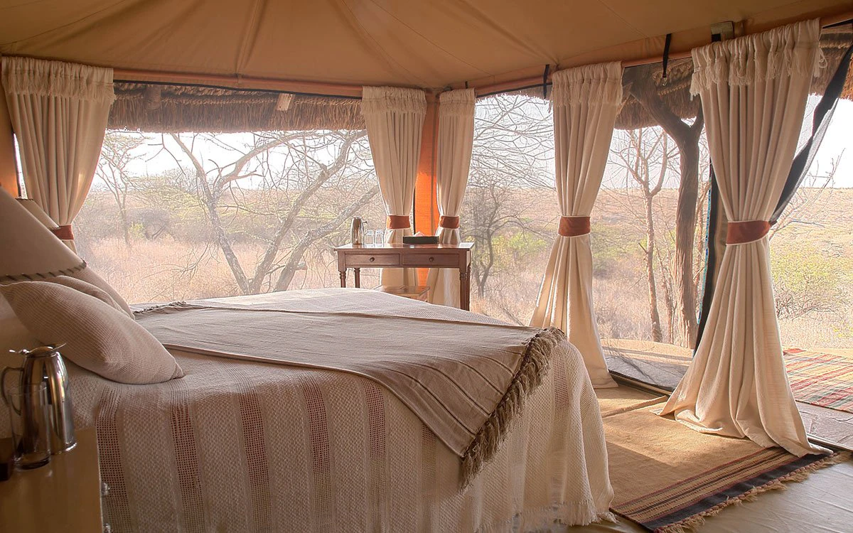 Internal view of the double bed inside one of the bedrooms at Lewa
