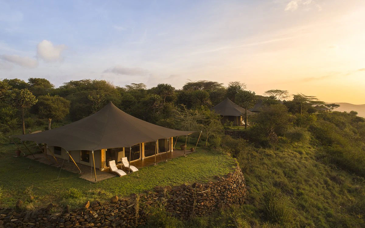 Aerial view of the exterior of Loisaba Tented Camp as the sun begins to rise