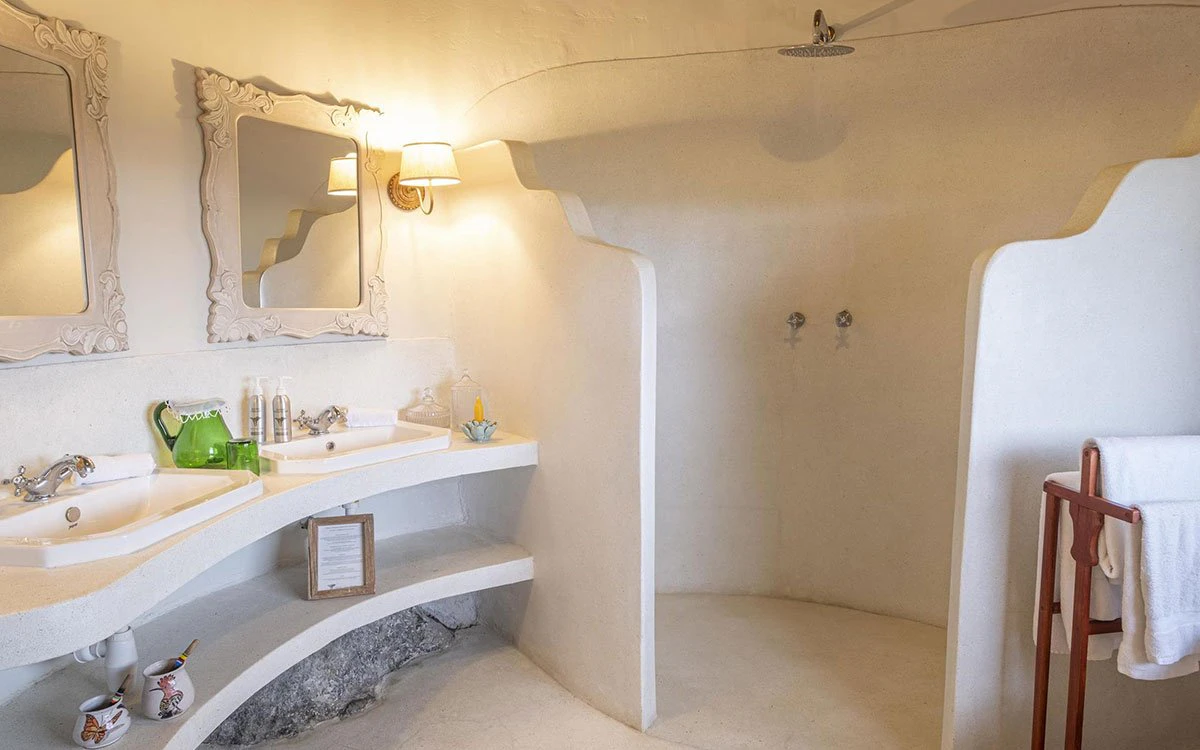 Internal image of an en suite bathroom at Loldia House with the walk in shower and double sink in view