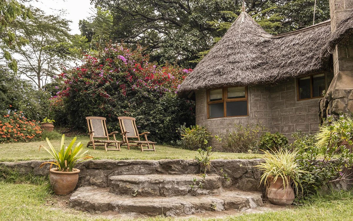 External image of Loldia House showcasing its thatched roof and outdoor seating