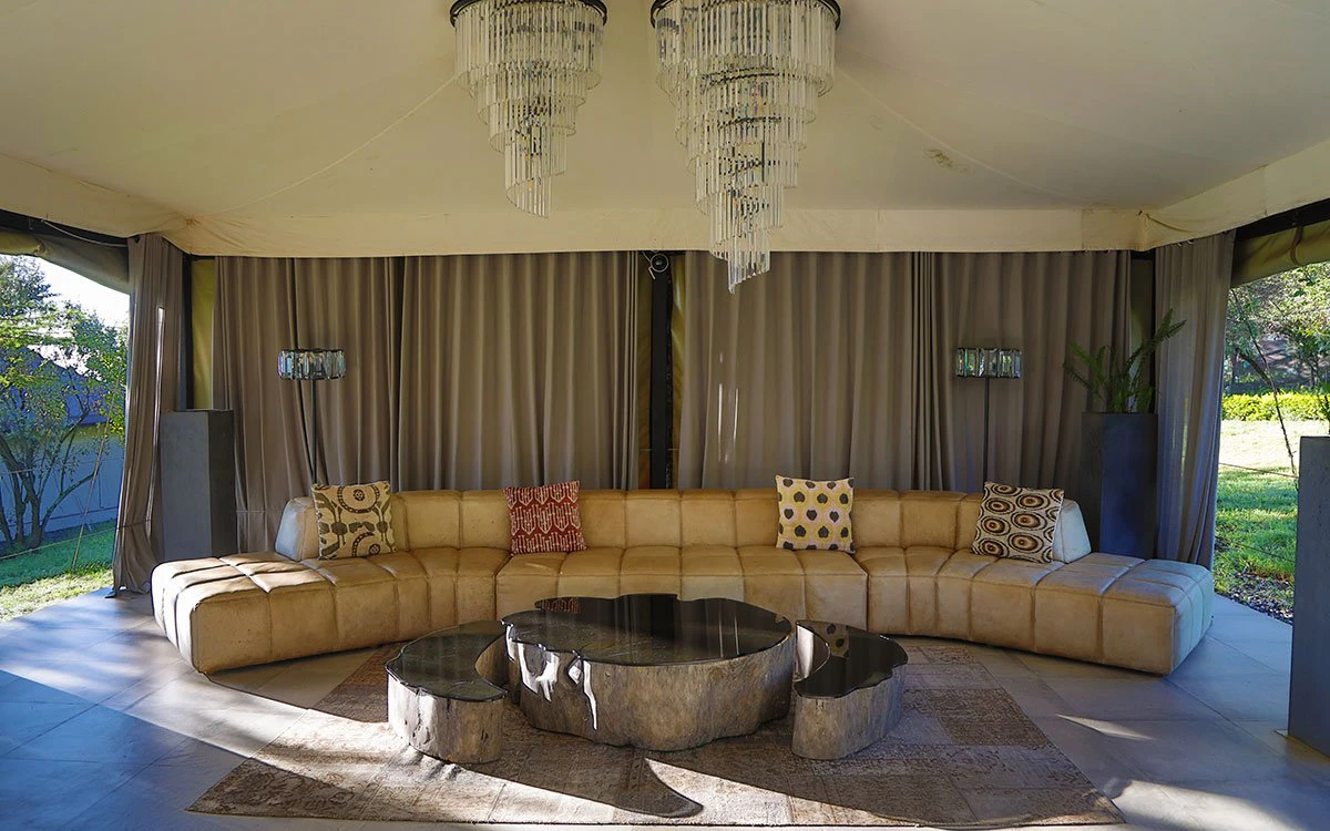 A large communal area at The Cliff with a large, wraparound leather sofa in view