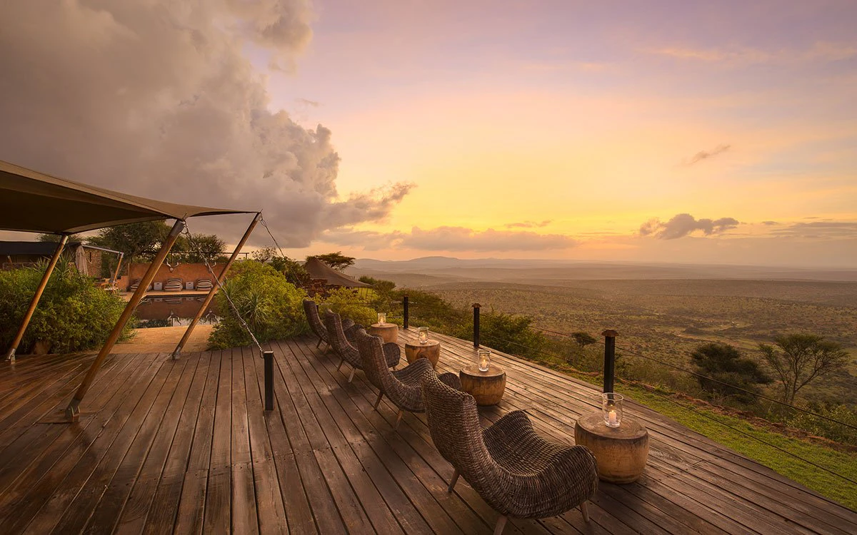 The view looking out to the savannah from the main area deck at Loisaba Tented Camp at sunrise
