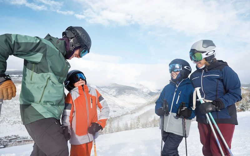 Happy family at Vail Resort, showcasing the balance of adventure and comfort Happy family at Vail Resort, showcasing the balance of adventure and comfort