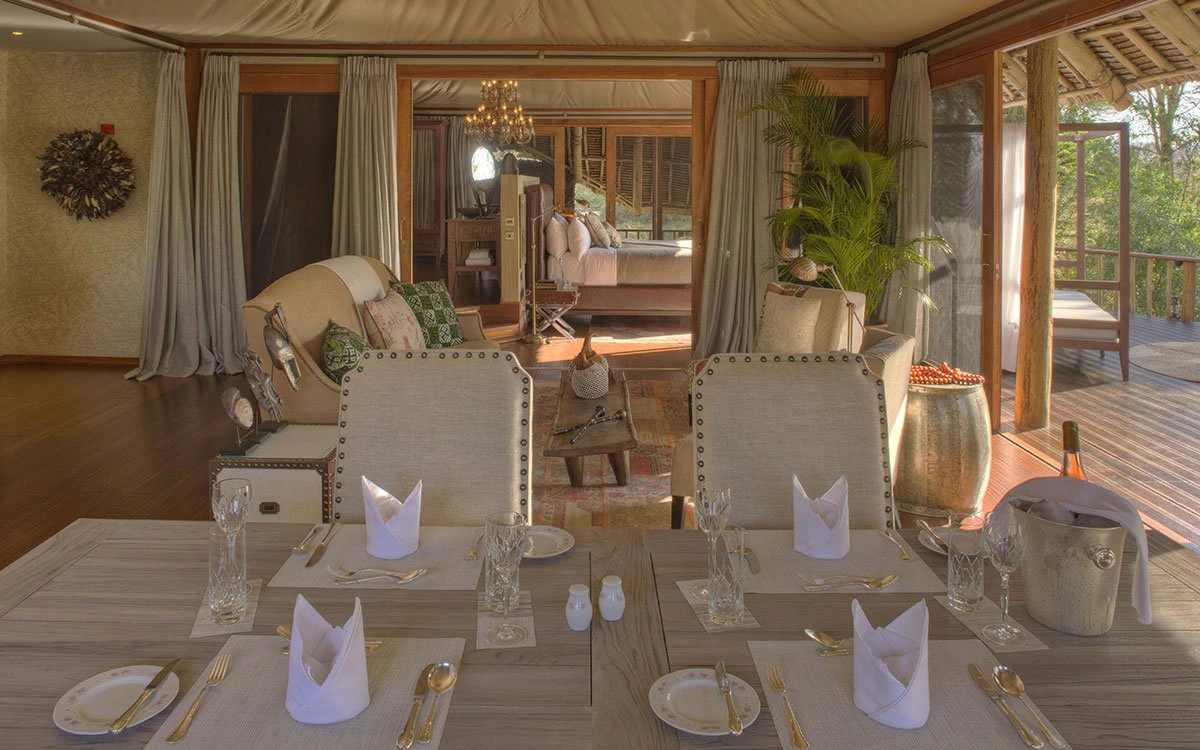 A lavishly laid dining room table inside one of Finch Hattons' suites