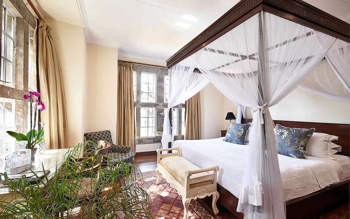 Internal view of the luxury bedroom in one of the suites at Giraffe Manor