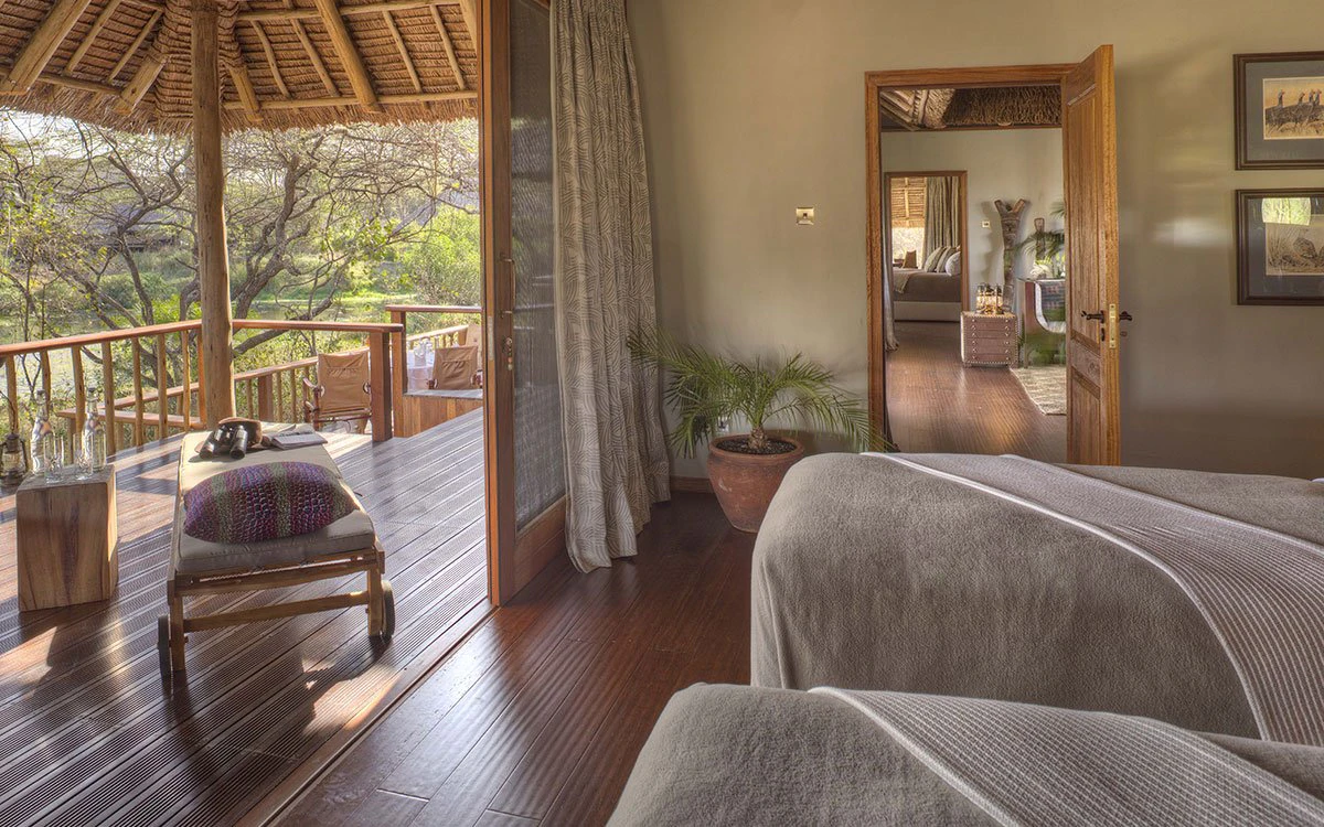 A family suite at Finch Hattons where the twin bedroom and private veranda can be seen