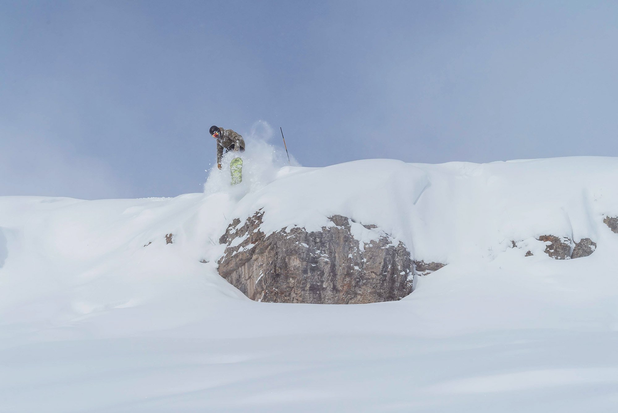 A joyful group of skiers displaying their Epic Local Passes at a Vail-owned resort