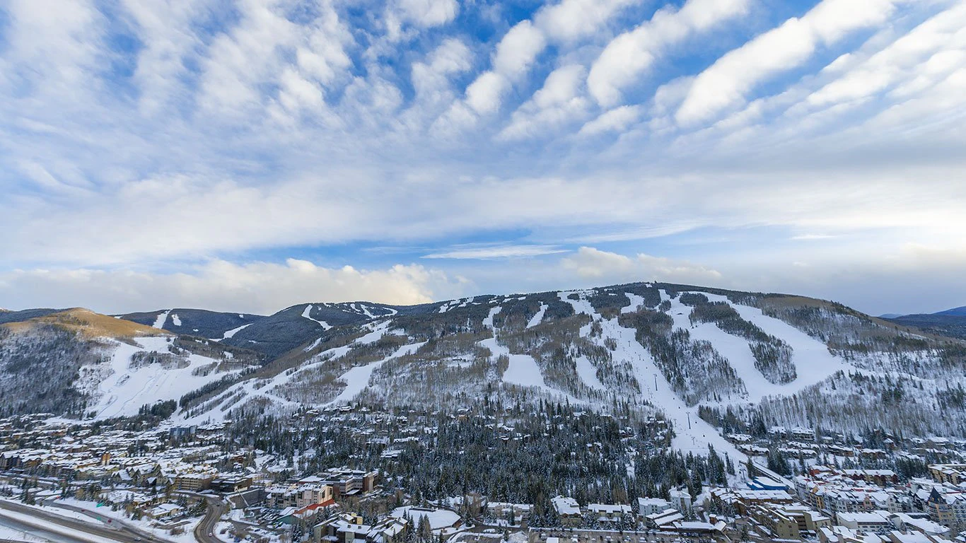 Early morning over Vail Resort, with hotels in the foreground and the ski slopes in the background Early morning over Vail Resort, with hotels in the foreground and the ski slopes in the background