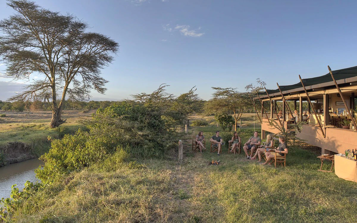 A group on vacation enjoy their sunset drinks at Ol Pejeta A group on vacation enjoy their sunset drinks at Ol Pejeta