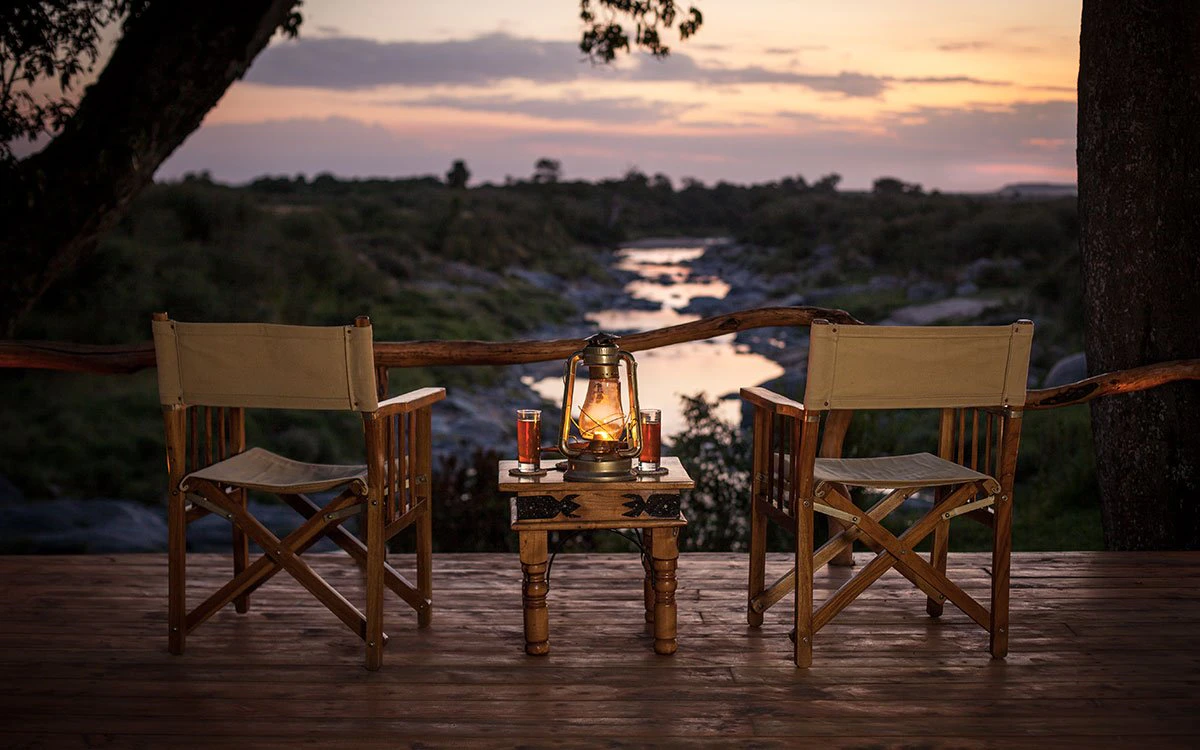 Two chairs waiting invitingly for guests to enjoy sunset drinks at Rekero Camp