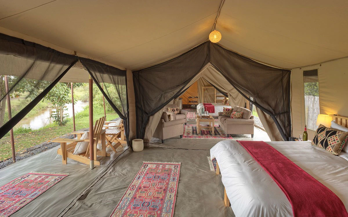 Internal view of the master bedroom and the lounge inside the family tent at Ol Pejeta