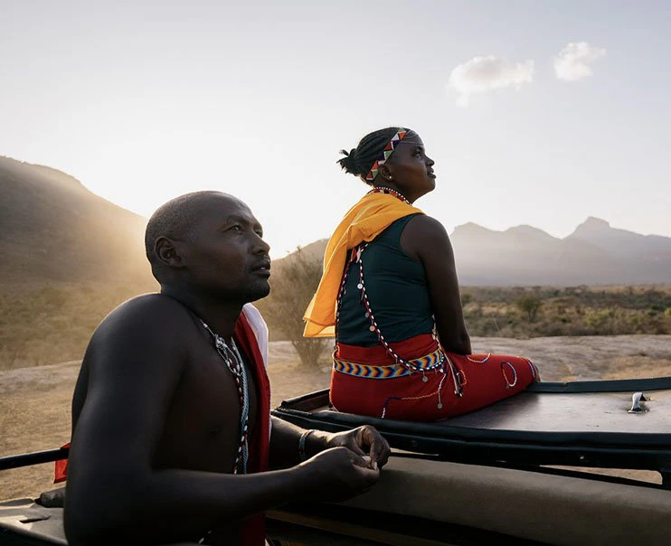 A pair of knowledgeable local guides discuss the local culture and traditions A pair of knowledgeable local guides discuss the local culture and traditions
