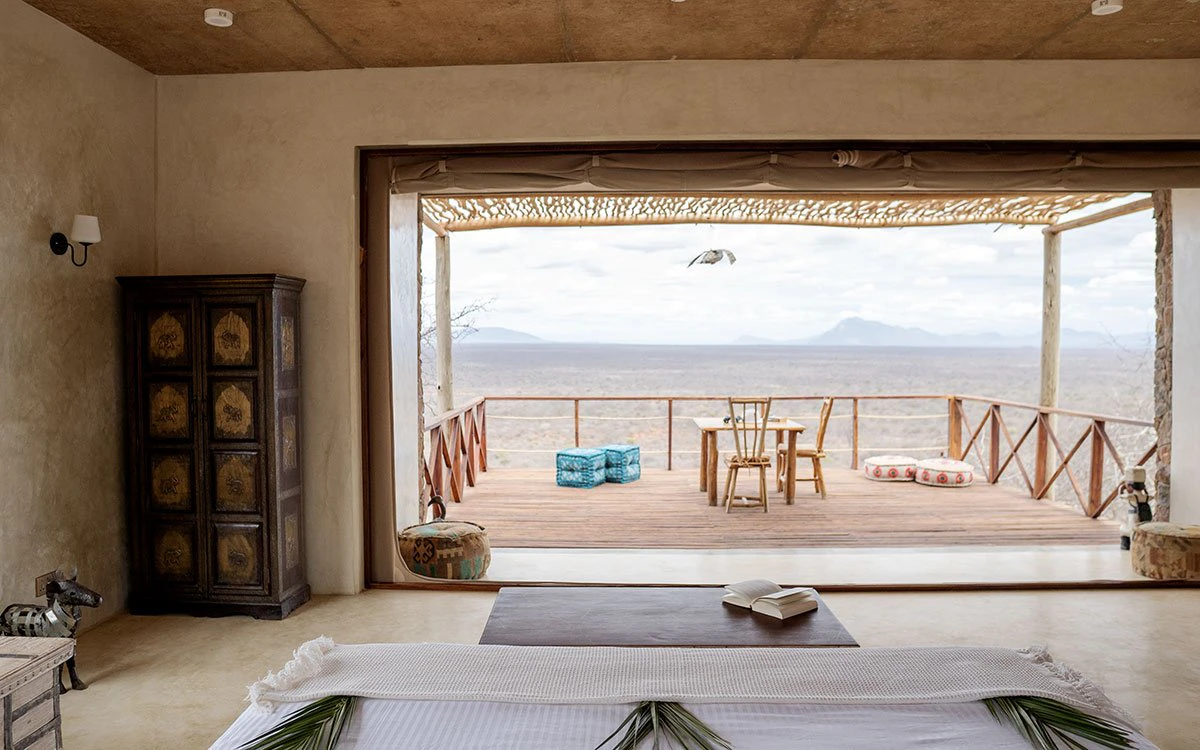 View from the bed at Kipalo Hills' Cliff Villa showcasing the private deck and a lovely view