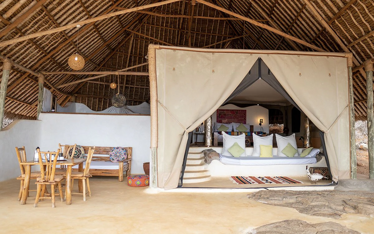 Interior view of the Rock Suite at Kipalo Hills with the bed and dining area in view
