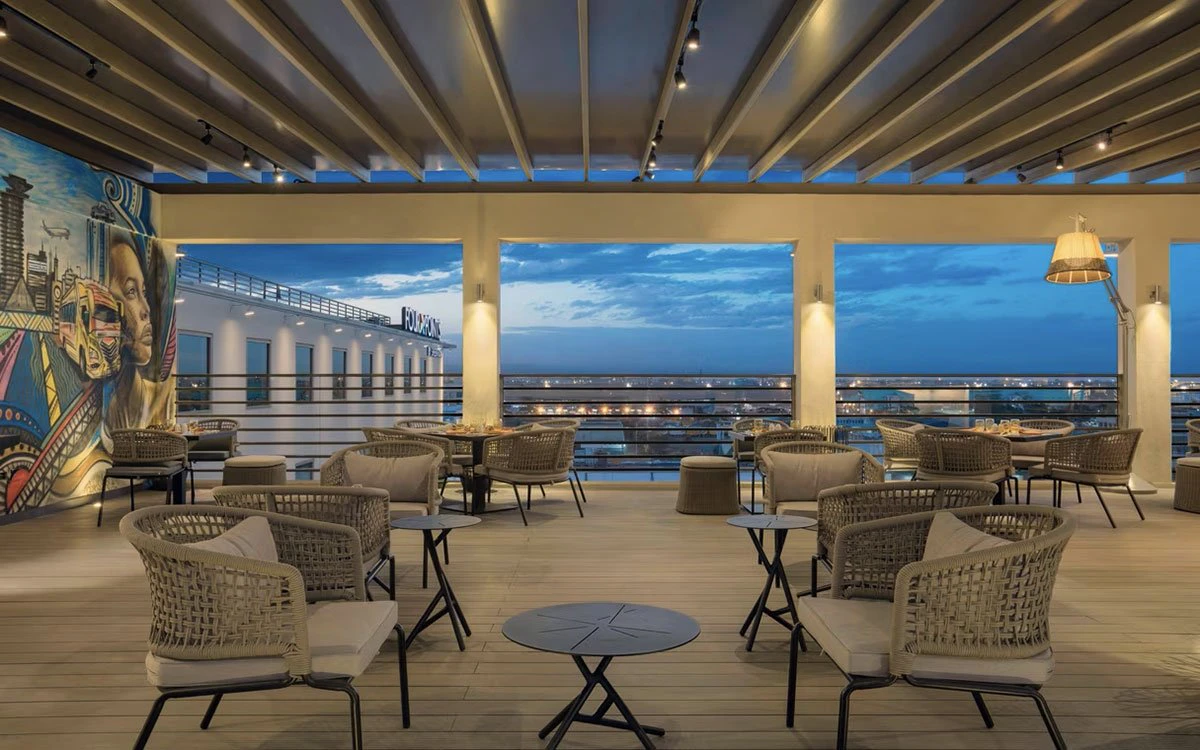 Wide angle view of the Tazama rooftop dining area at Four Points by Sheraton