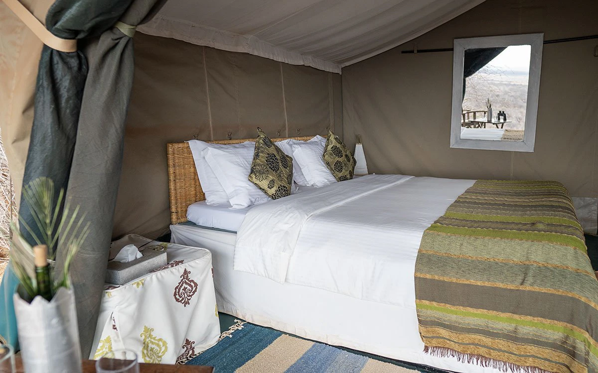 Interior view of a bedroom in one of Kipalo Hills' standard tents
