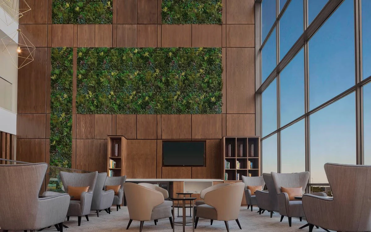 Interior image of the business lounge at Four Points by Sheraton with comfortable seating and large floor to ceiling windows