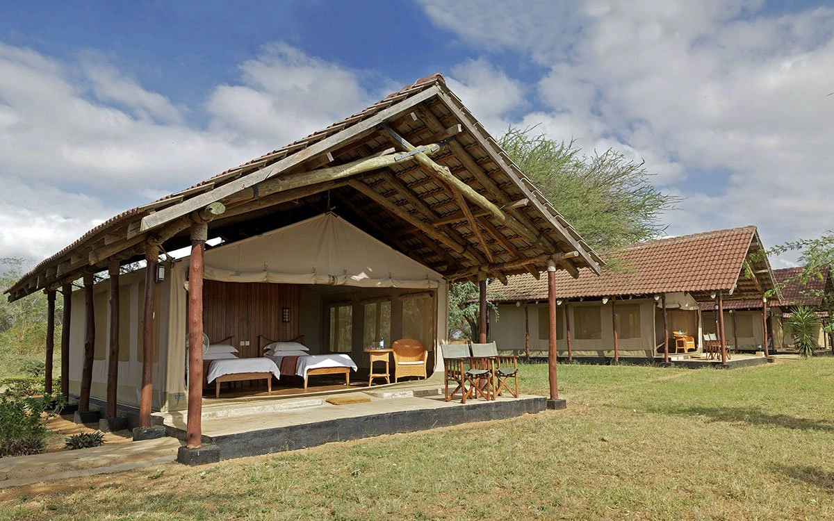 Exterior view of two of Ashnil Aruba's tented rooms