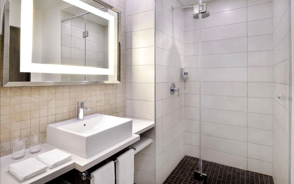 Interior image of a luxury en suite bathroom at one of Four Points by Sheraton's deluxe suites