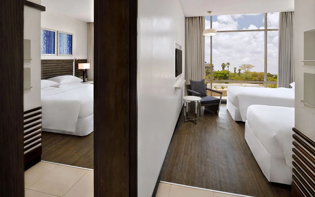 Interior view of the king guest room at the Sheraton highlighting both bedrooms