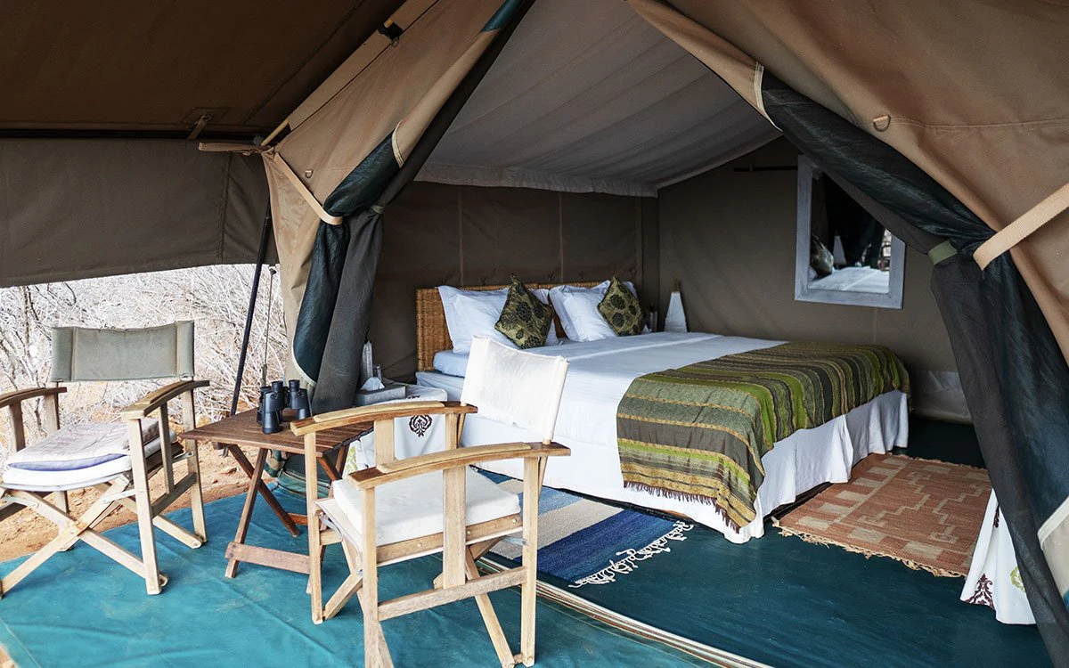 View of both the bedroom and outdoor deck of one of the standard tents at Kipalo Hills