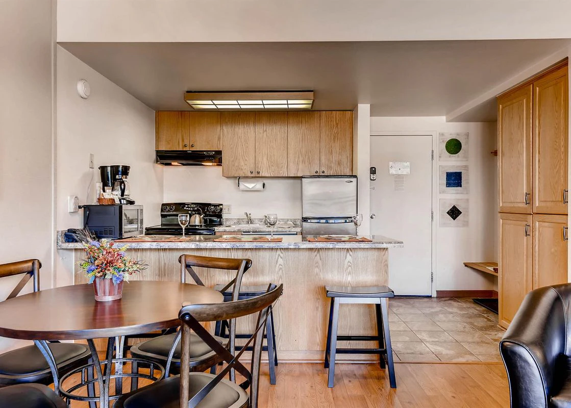 Internal image of the kitchen and dining area of a condo in Edelweiss Haus.