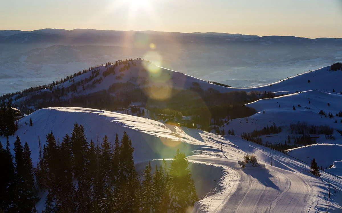 Dawn in Park City as snowcats groom fresh snow for the day’s skiing.