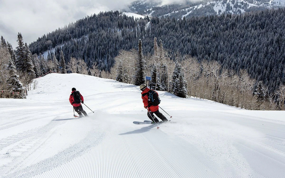Two members of the Park City ski patrol journey down the mountain.