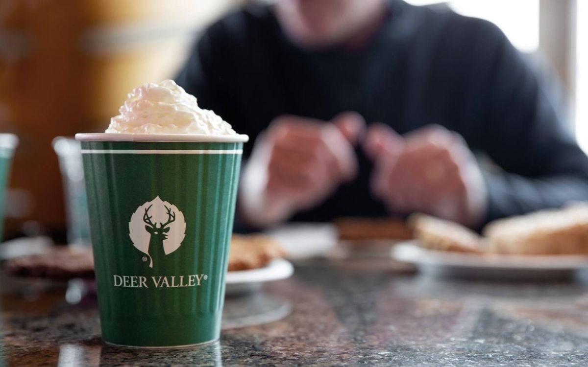 A warm, soothing takeaway cup of hot chocolate with whipped cream from Daly Lift Coffee.