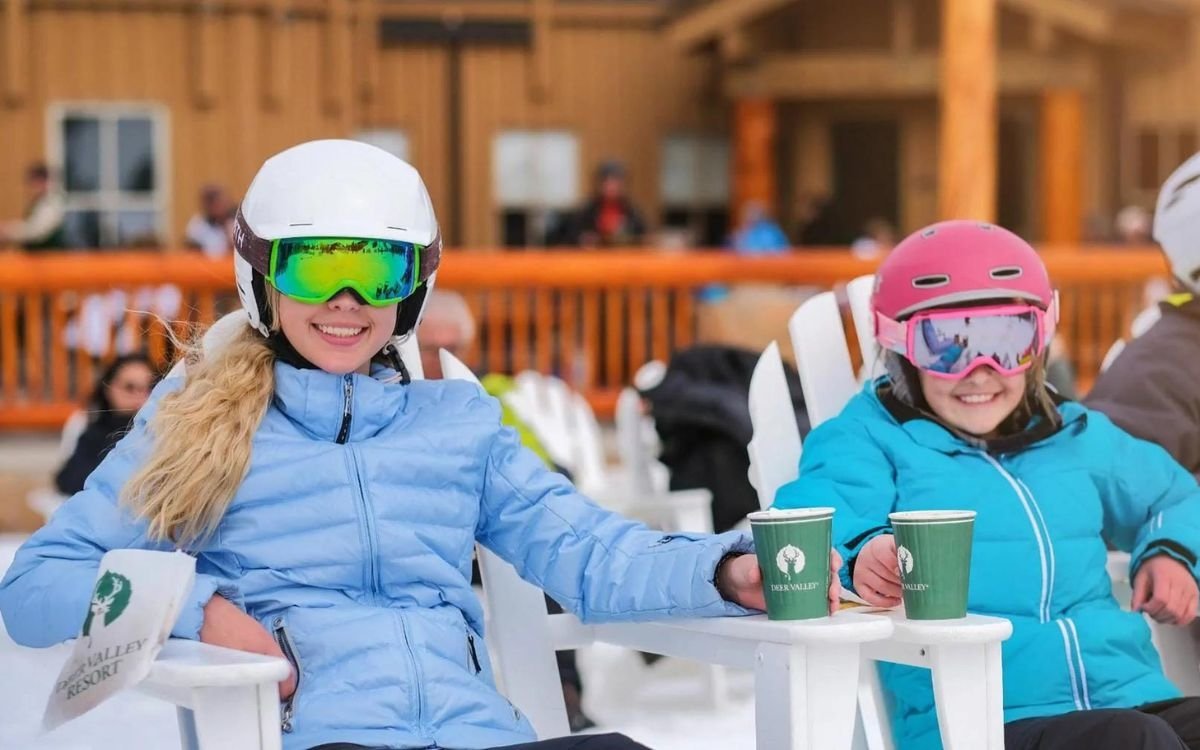 Two skiers enjoy a drink outside of Silver Lake Restaurant.