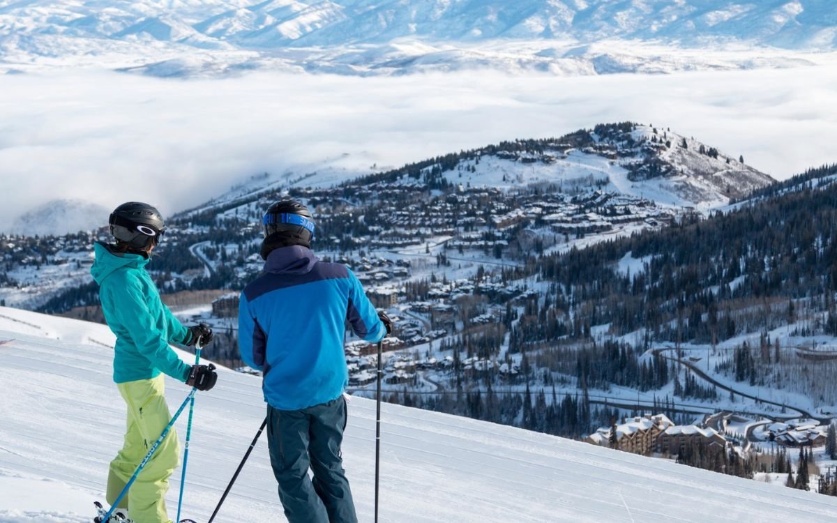 A pair of skiers take a quick breather before continuing their day on the mountain in Deer Valley.