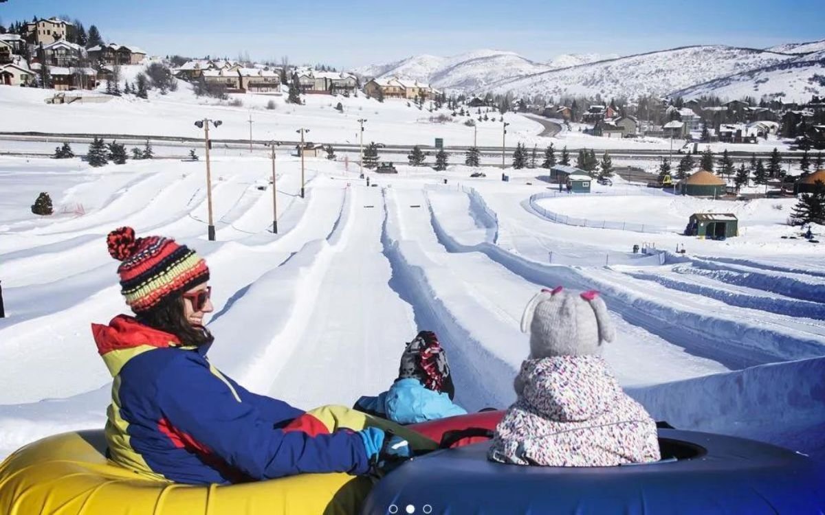 A mother and daughter enjoy tubing at Woodward Park.