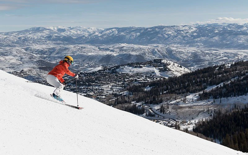 Skier on a snowy ridge at Deer Valley luxury rentals, with private lessons and lift tickets arranged by concierge. Skier on a snowy ridge at Deer Valley luxury rentals, with private lessons and lift tickets arranged by concierge.
