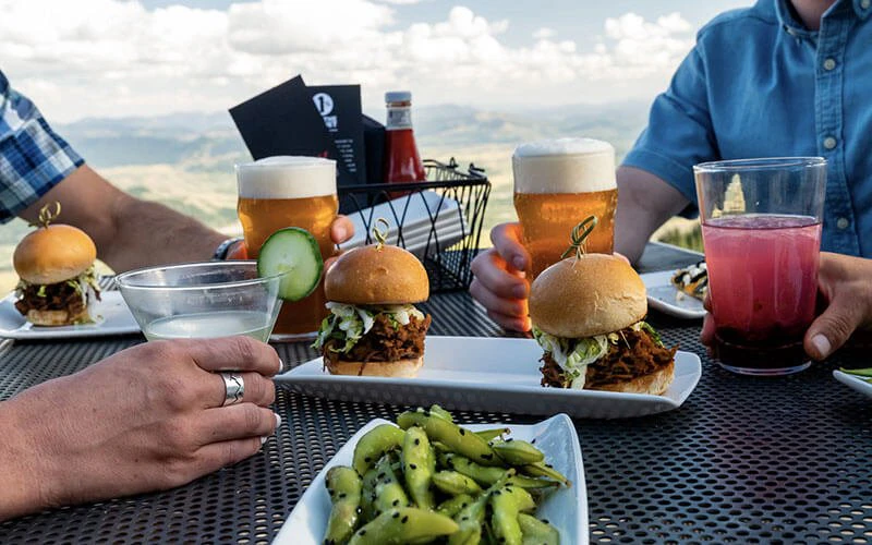 Gourmet burgers and craft cocktails on a scenic patio, representing private chef and dining perks with Breckenridge luxury rentals. Gourmet burgers and craft cocktails on a scenic patio, representing private chef and dining perks with Breckenridge luxury rentals.