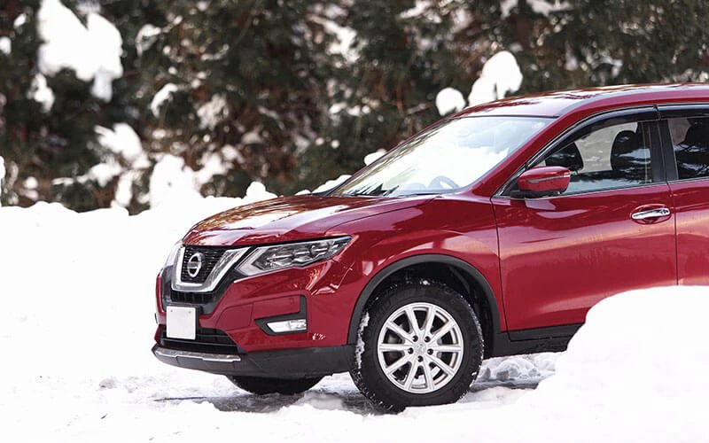 Red SUV in a snowy setting, representing private transport options with Whistler Luxury Rentals. Red SUV in a snowy setting, representing private transport options with Whistler Luxury Rentals.