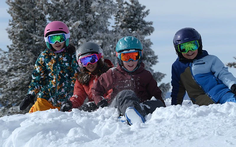 Kids playing in the snow near Steamboat Resort—family-friendly amenities and ski lessons arranged by Steamboat Luxury Rentals. Kids playing in the snow near Steamboat Resort—family-friendly amenities and ski lessons arranged by Steamboat Luxury Rentals.