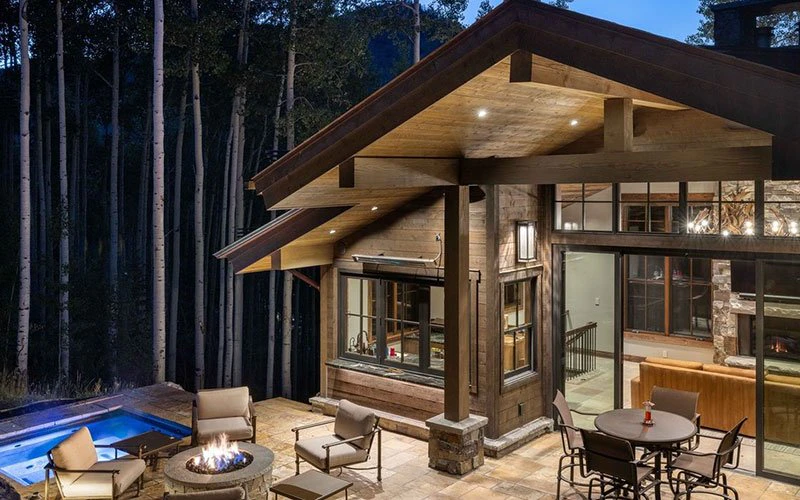Ascension Vail ski-in/ski-out mountain home with outdoor fire pit, pool, and forest views.