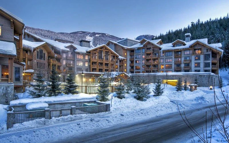 First Tracks Lodge Whistler ski-in/ski-out condo with alpine architecture and direct mountain access.