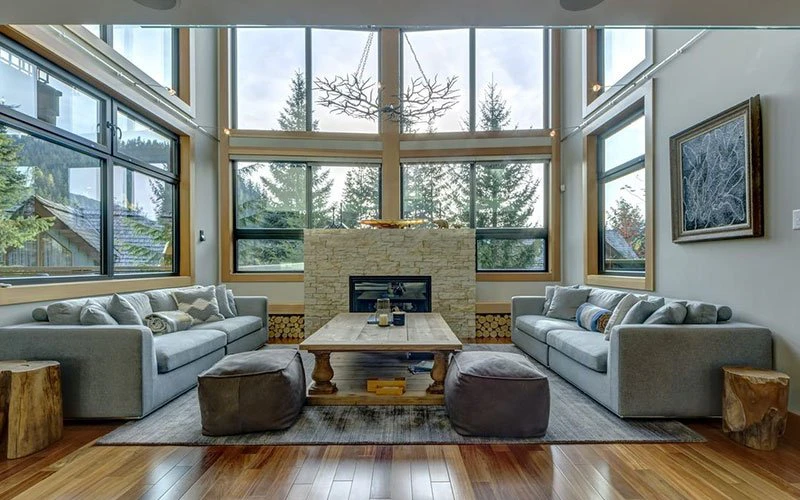 Snowridge Views Whistler ski-in/ski-out chalet with large windows and forest views.