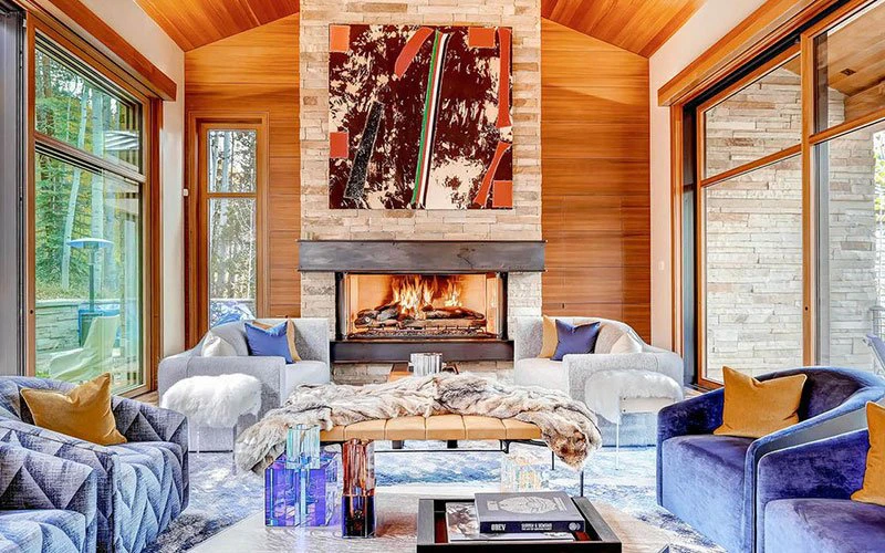 Quantum Vail ski-in/ski-out luxury chalet with modern interiors and stone fireplace.